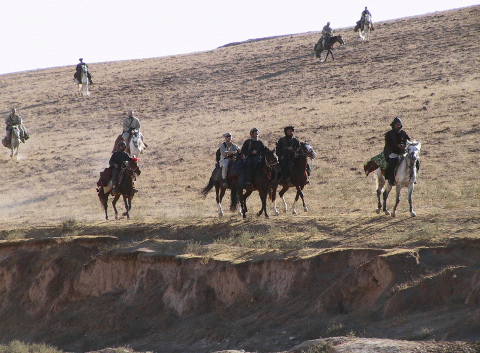 Special Forces soldiers from Task Force Dagger and Commander Dostum on horseback in the Dari-a-Souf Valley, Afghanistan. 